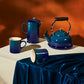 Le Creuset agave ceramic coffee french press, kettle, and mugs.