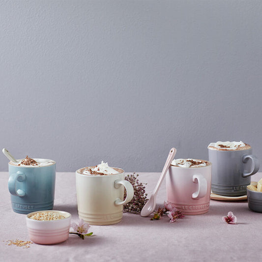 Le Creuset Calm Collection Cappuccino Mugs in soft pastel colours, showcasing cozy coffee moments, perfect for gifting.