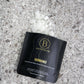 Bathorium Hinoki magnesium bath fakes packaging on a textured surface with white crystals.